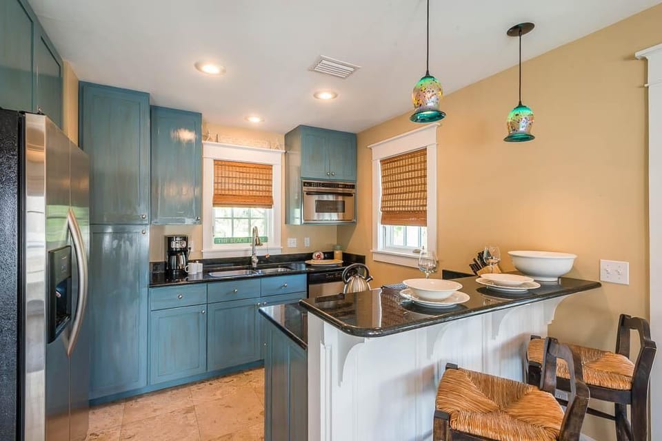 Fully Stocked kitchen with stainless steel appliances and granite countertops.