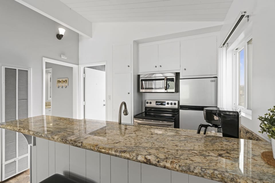 The kitchen includes all necessary cooking/dining gear and appliances (no dishwasher). Guests must supply their own coffee, spices, condiments, and paper goods like napkins, plastic wrap, etc.
                