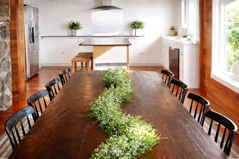 Gather together at this oversized dining table with stunning views of the Pacific—ideal for shared meals and conversation