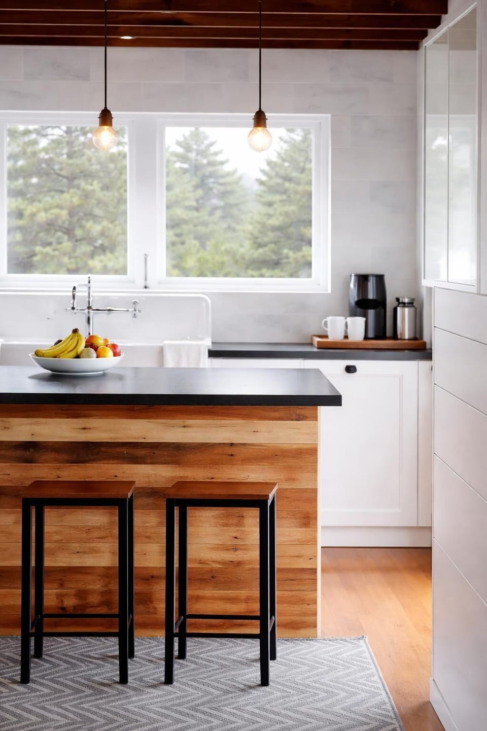 Modern kitchen island with seating, natural light, vintage touches, and clean, updated finishes