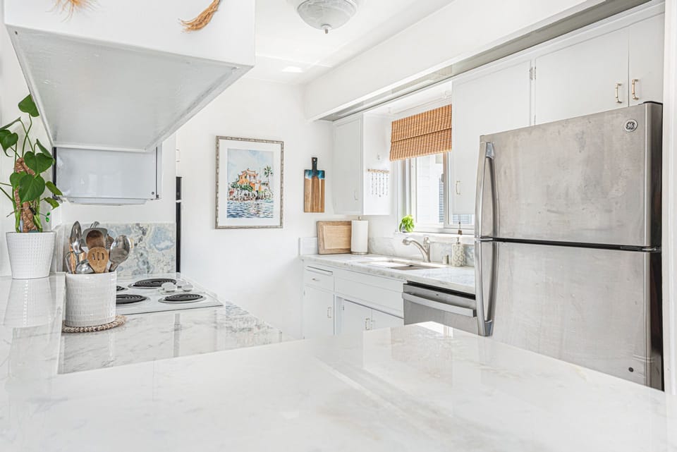The kitchen comes stocked with dishes, utensils, cookware, bakeware, and all large and small appliances.
                