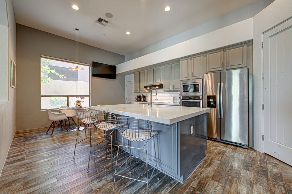 The Kitchen Island/ Breakfast Bar with wall hung TV