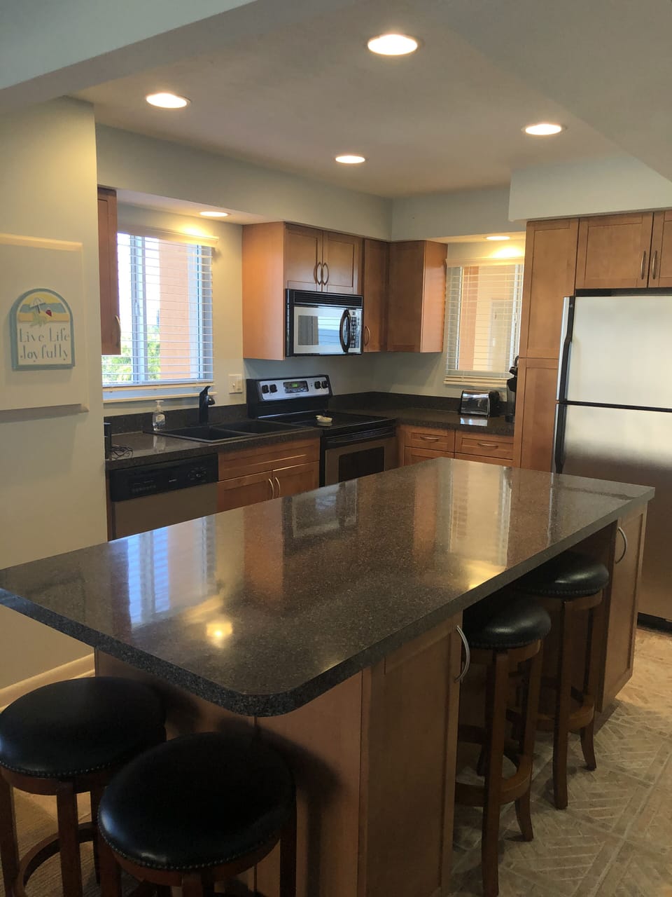 Open kitchen with everything you need.  Large island for casual dinning. 