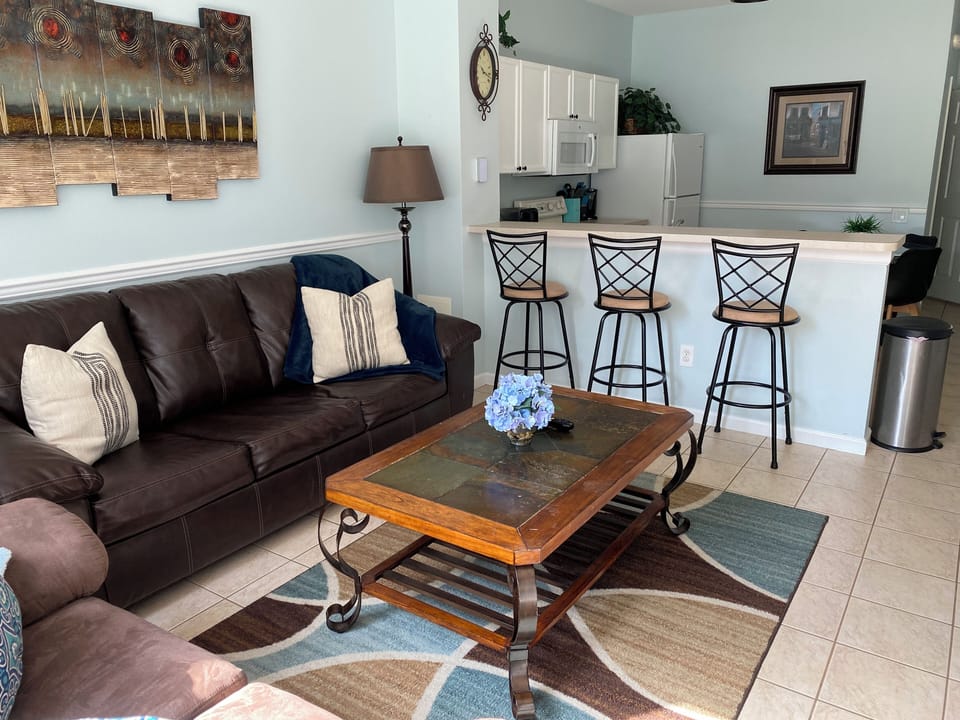 Living room with the kitchen in the background 