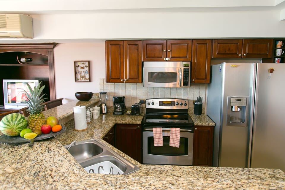 Well appointed kitchen stocked with basic items for your cooking needs