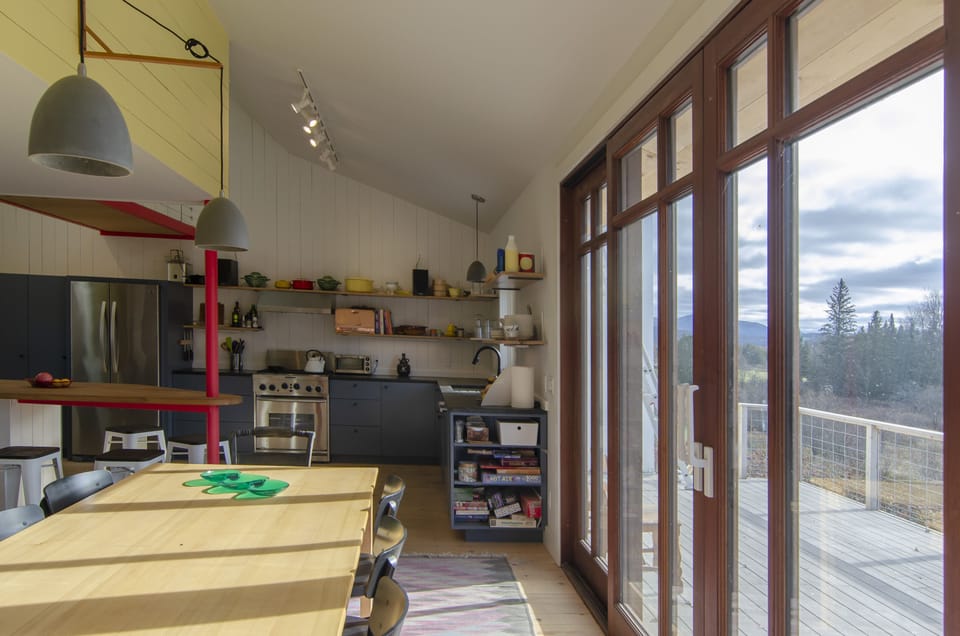 dining table for 10 with sliding glass doors to deck