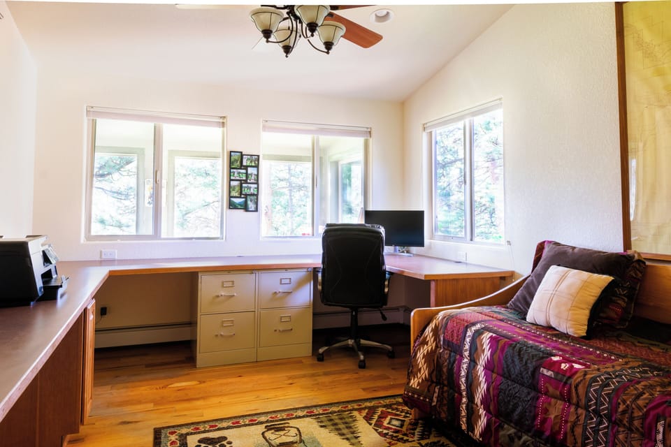 Office with trundle bed that can be pulled out to make a king bed. 