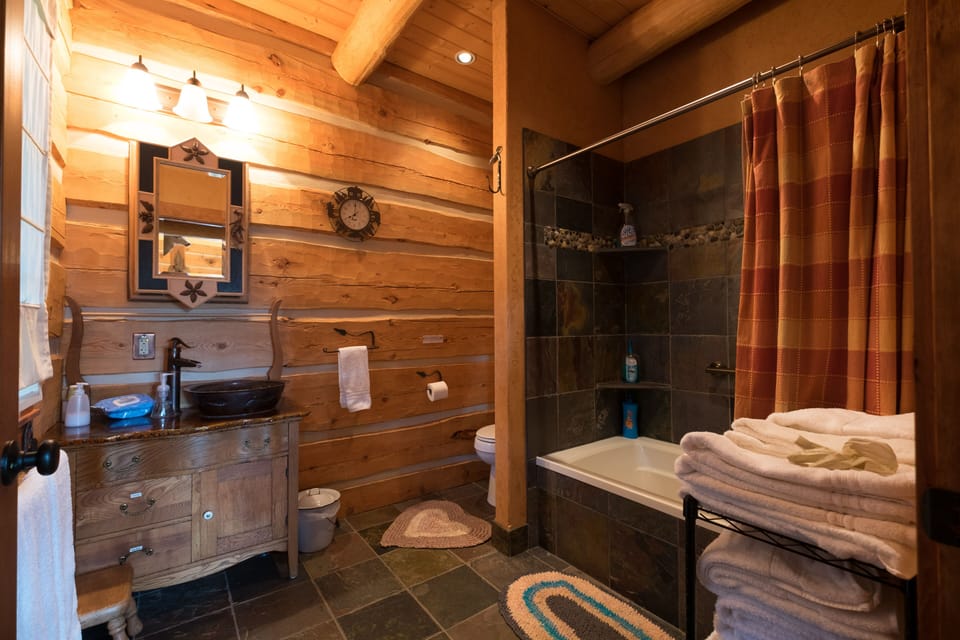Main floor bath with copper sink & antique washstand.