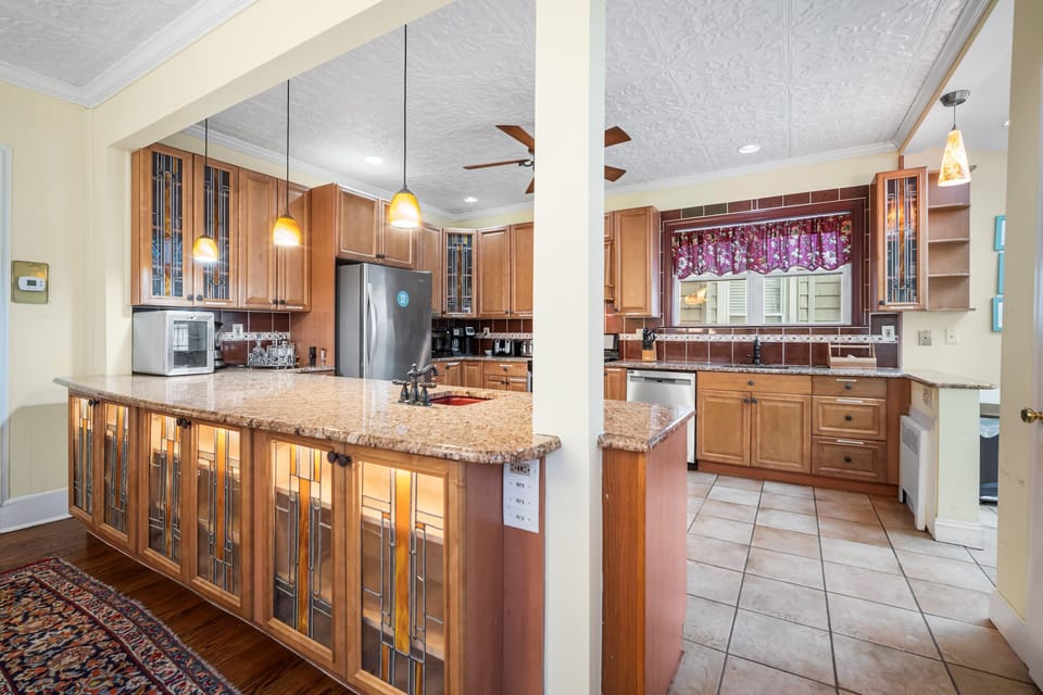 Dining and Kitchen Areas Featuring Stained Glass Cabinetry