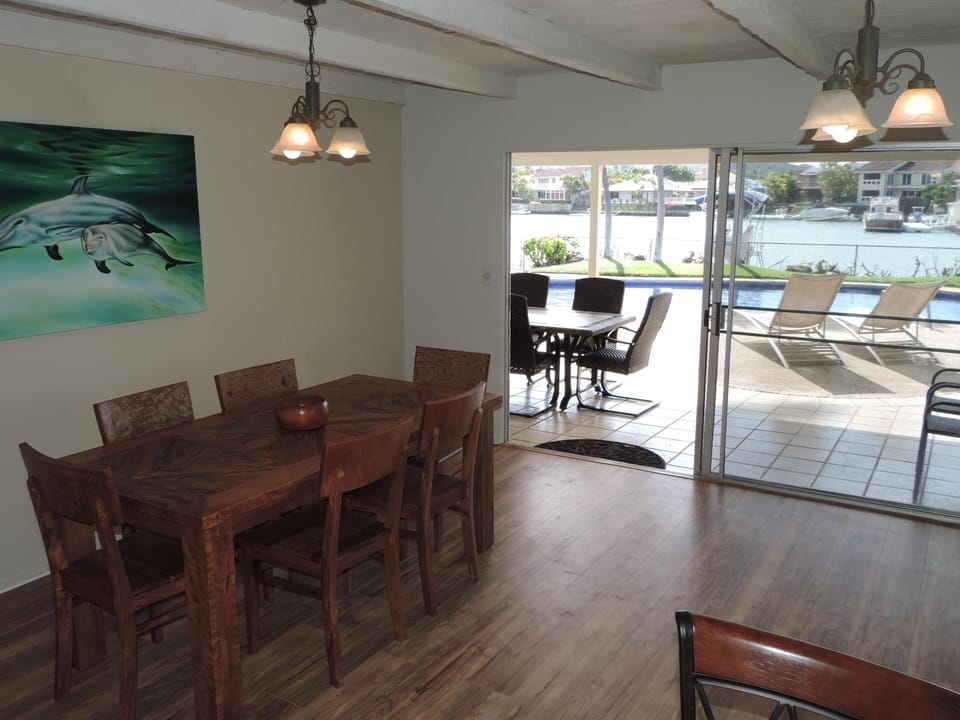 Dinning Room Looking Out To Pool and Outside Dinning Table