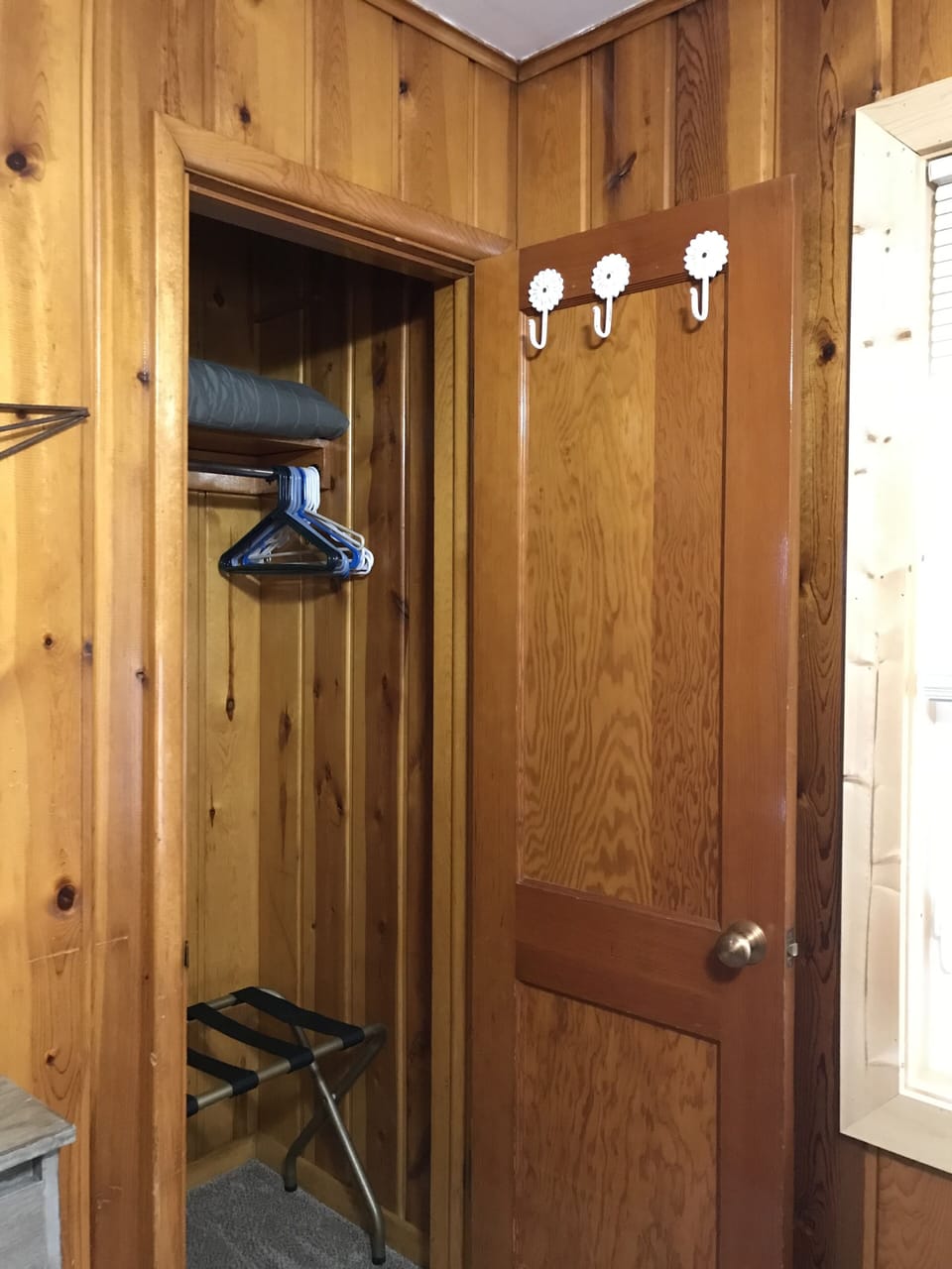 Storage hooks on bedroom door.  Luggage rack located in closet.