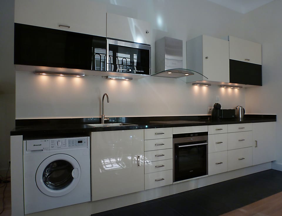 Microwave, oven, 4 elements, fridge, dishwasher, washing machine/dryer.