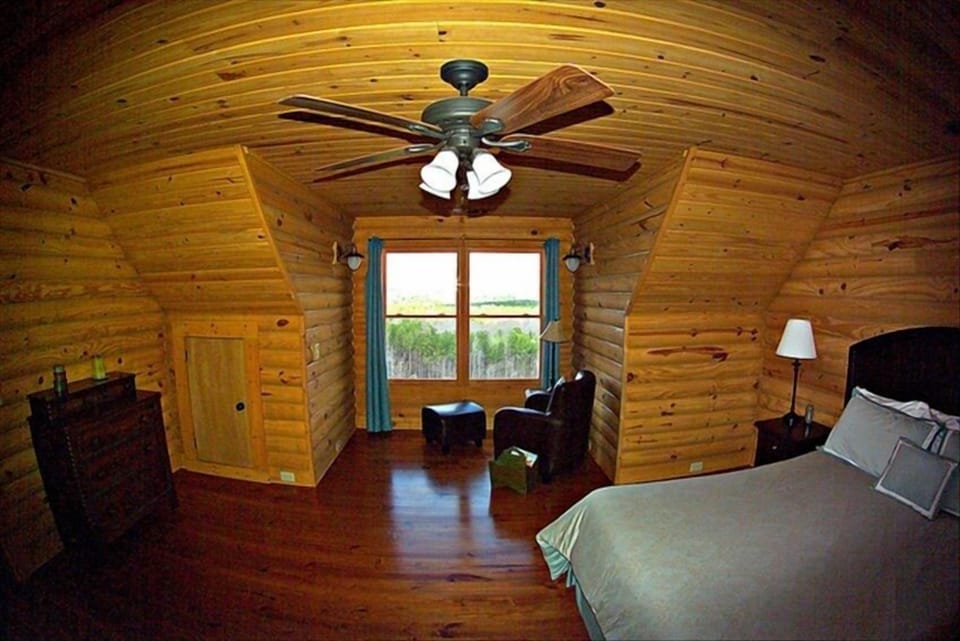 master bedroom with king bed and separate bathroom.