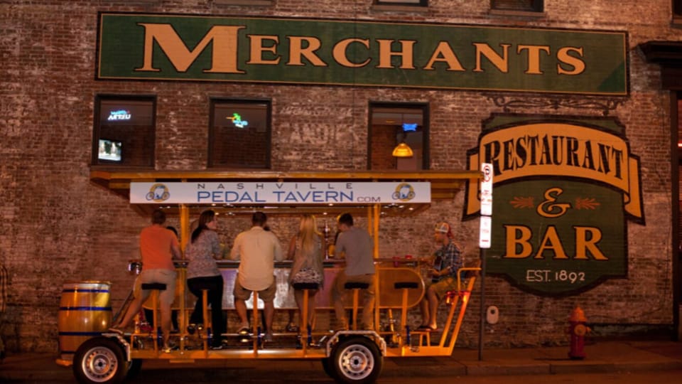 Nashville's Famous Pedal Tavern. Enjoy an adult beverage while sitting at a bar.