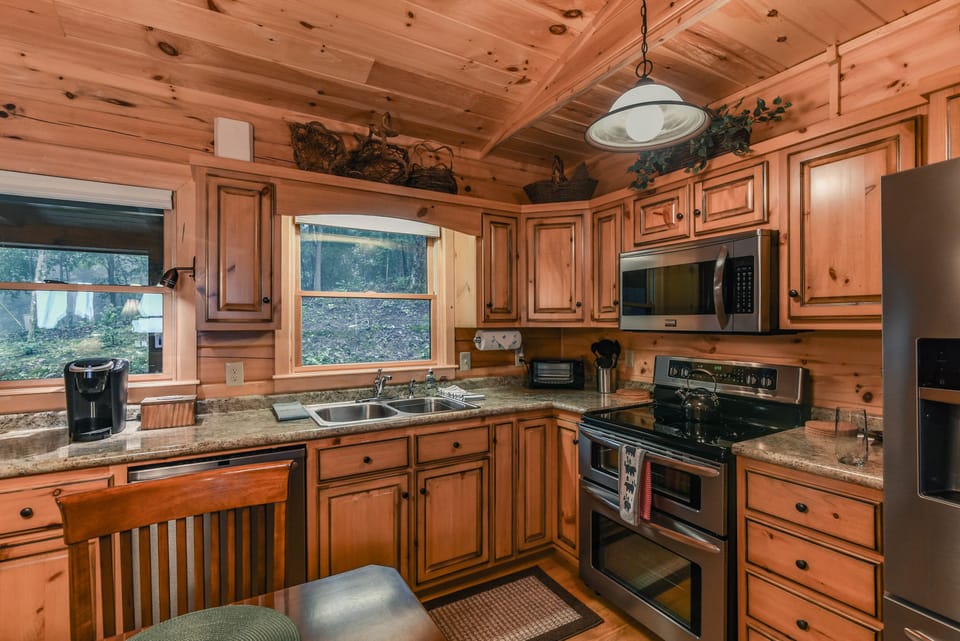Fully stocked kitchen with Keurig coffee maker, teapot and toaster oven