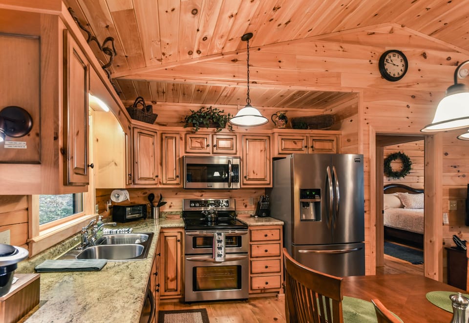 Fully stocked kitchen with a Keurig coffee maker, teapot and toaster oven