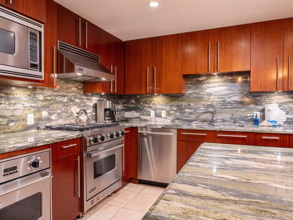 Cook like a pro in this fully equipped gourmet kitchen featuring stainless steel appliances, granite countertops, and a spacious layout for family meals or gatherings.