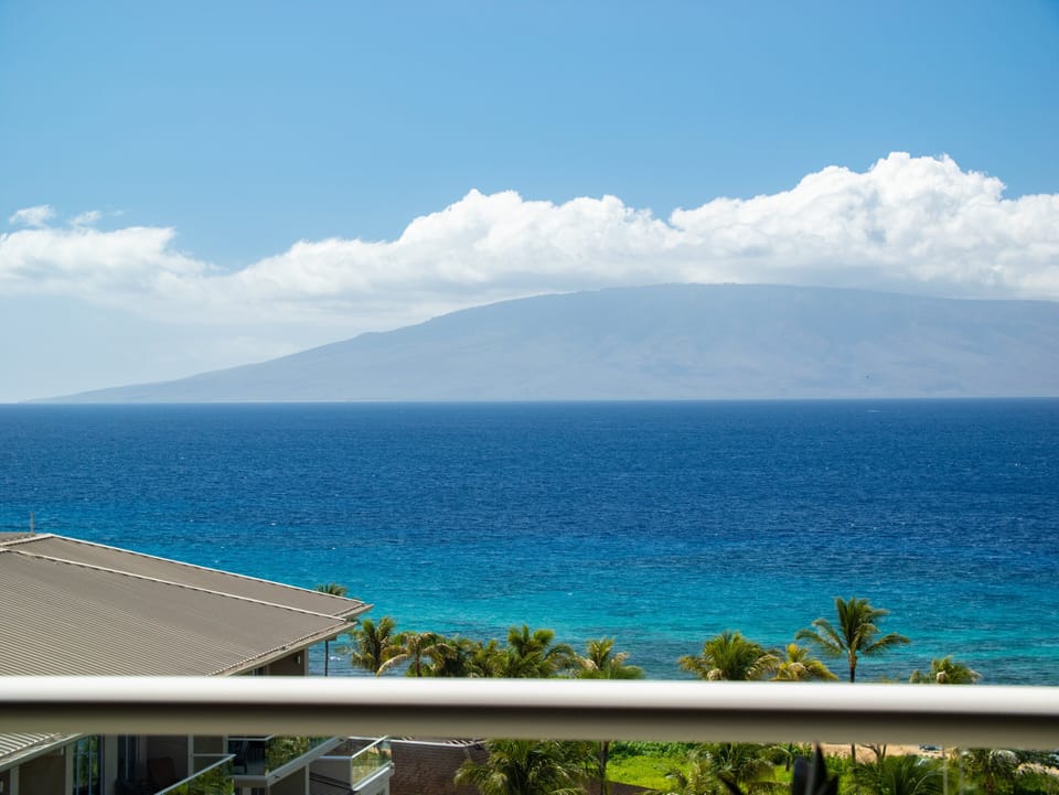 Savor unobstructed views of the Pacific Ocean and neighboring islands from your private balcony at this luxurious Maui resort. Perfect for a peaceful getaway.