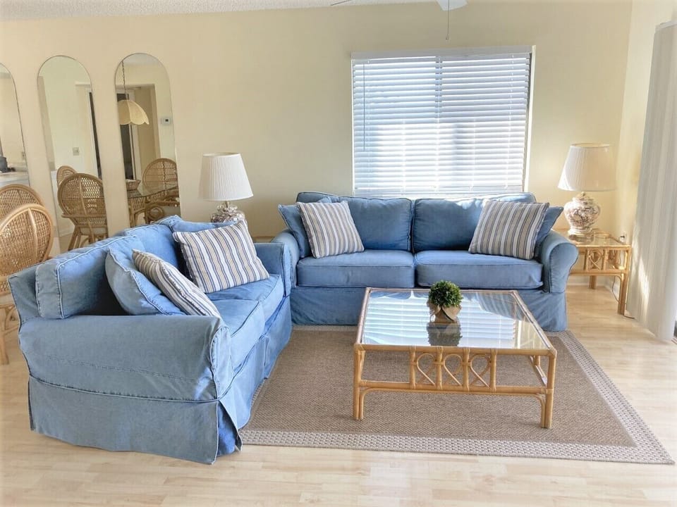 Bright, comfortable living room with queen sleeper sofa.  