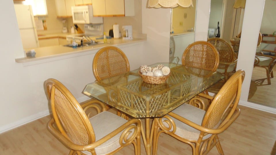 Sunny equipped kitchen and comfortable dining with seating for 6.