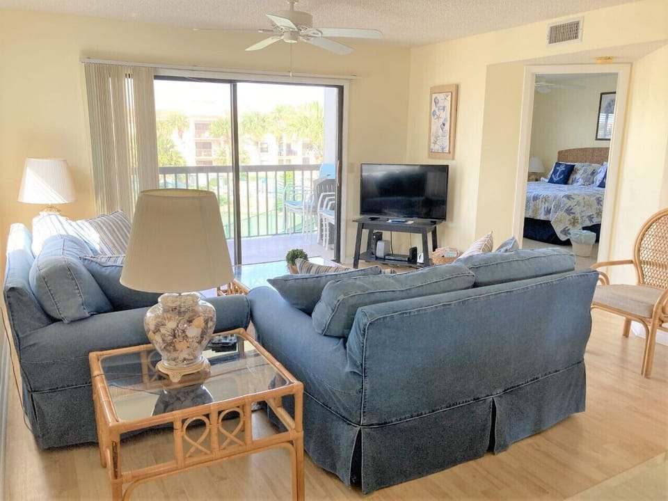 Bright, comfortable living room with queen sleeper sofa.  