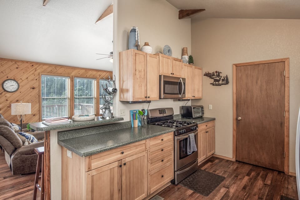 There is a range, microwave & a toaster in the kitchen.