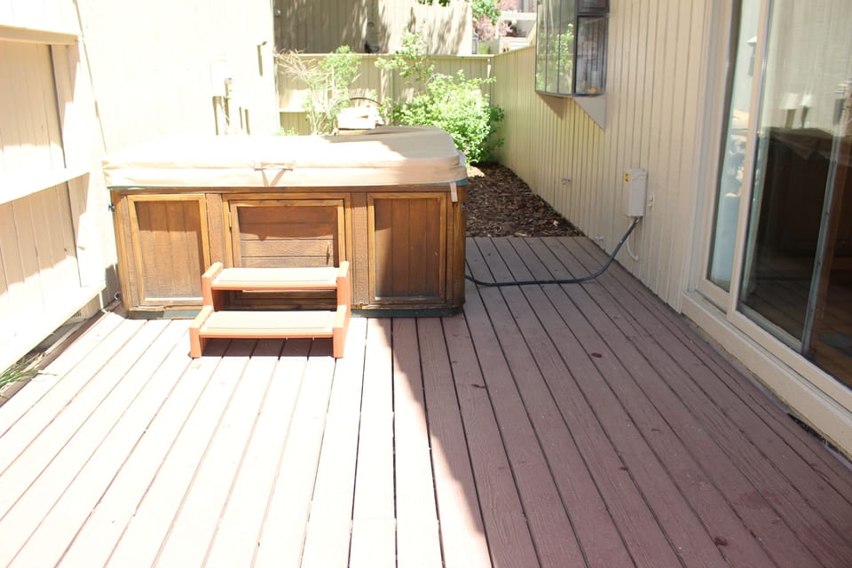 Large private deck off of dining room: includes hot tub, BBQ and deck