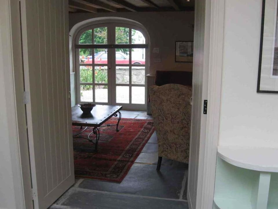 Arched Window of Living Room at front of the cottage.