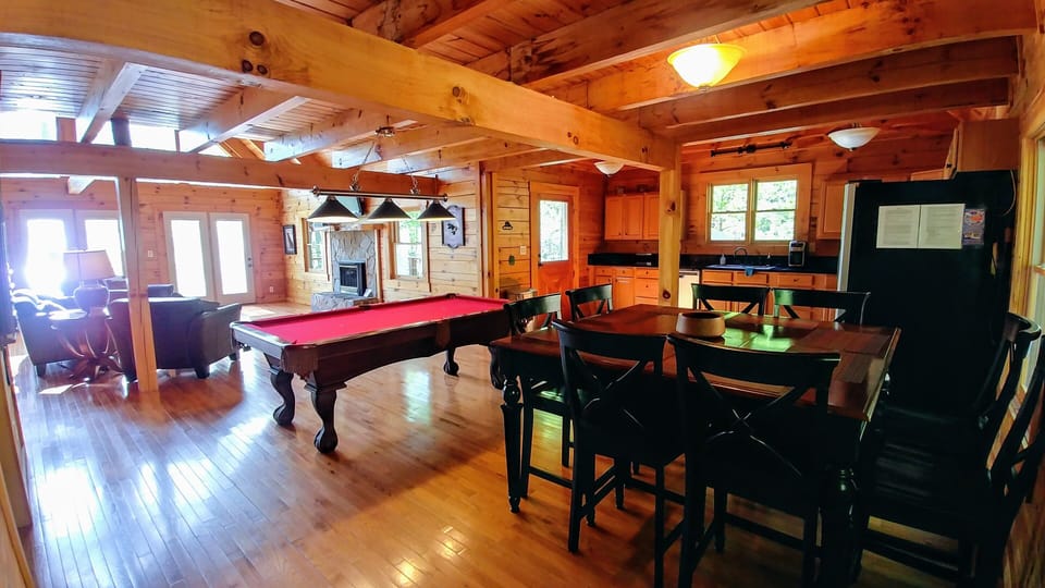 Spacious Open Living Area with dining seating for 8 at the table & 2 at the bar