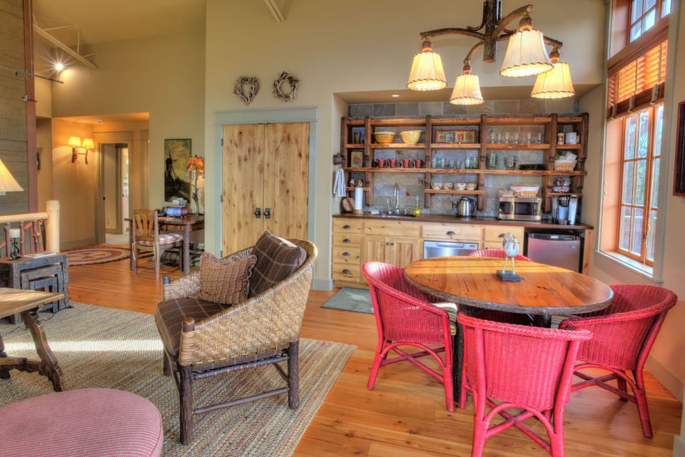 Partial kitchen includes small fridge, dishwasher, sink, microwave& dishes for 8