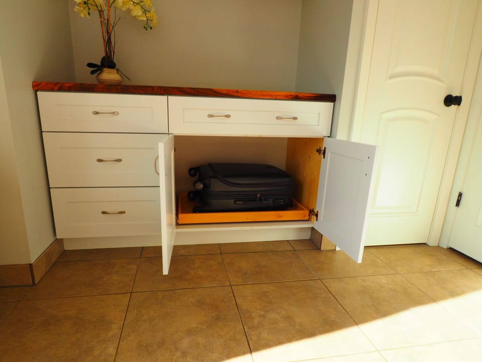 Prefer to work out of your suitcase? Our cabinet makes it easy and comfortable.