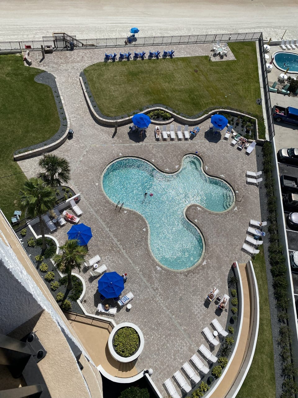 View off main balcony of newly renovated pool area with ocean front fire pit.