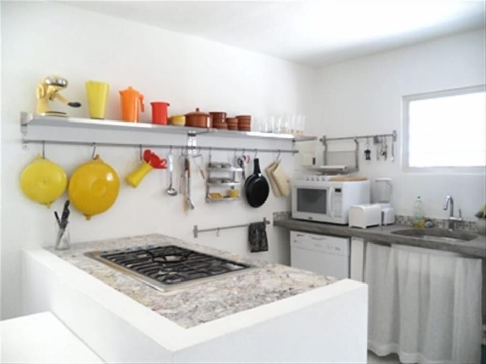 Chef's kitchen with granite countertop and gas stove