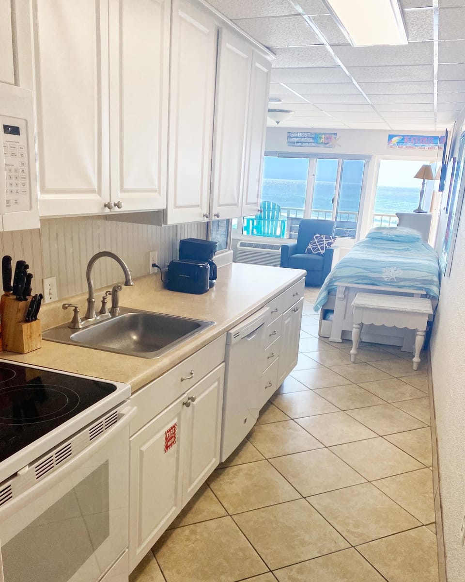 Kitchen with stove, microwave, dishwasher and refrigerator.