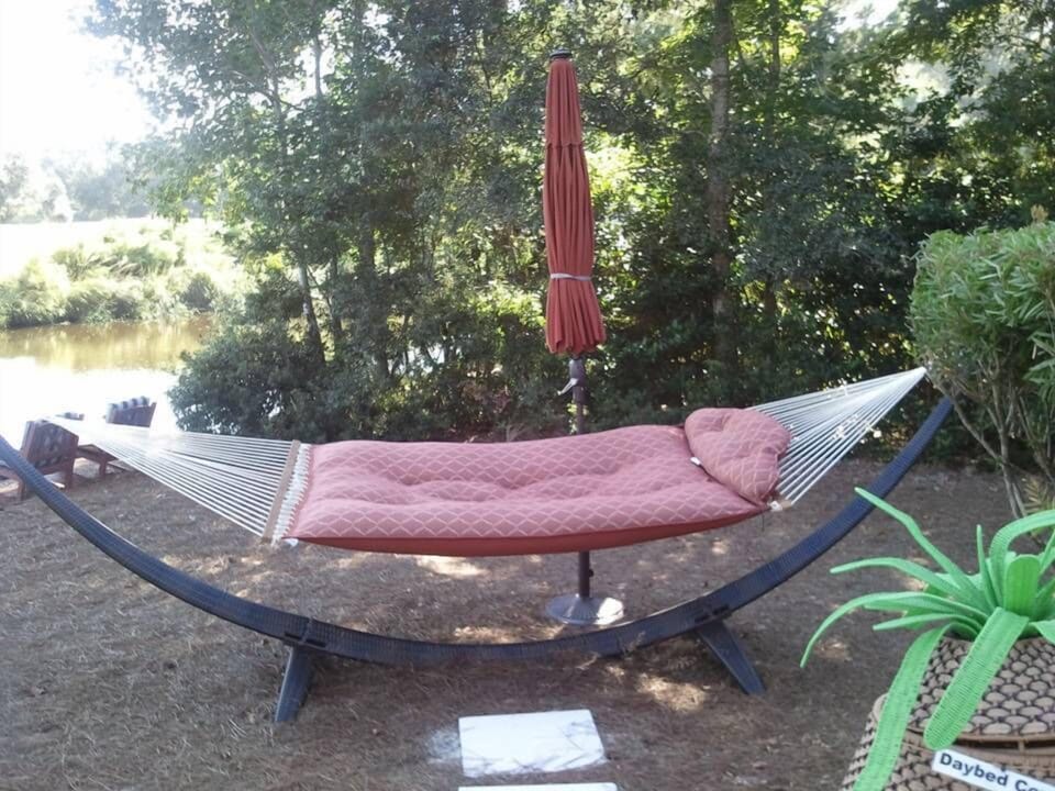 Comfortable hammock with pillow for a relaxing rest.