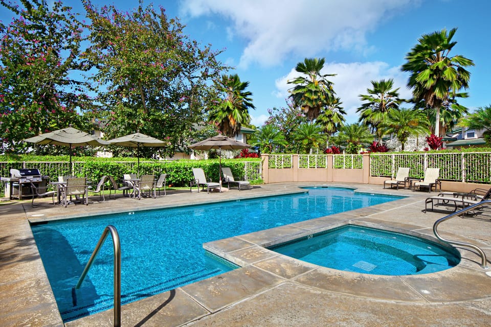 Unwind at the Villas of Kamalii community pool and hot tub, the perfect spot to soak up the Hawaii sun.
