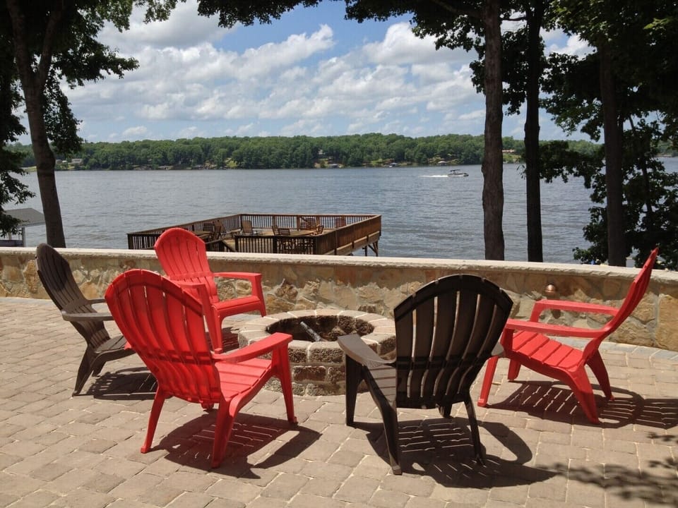 Huge patio with fire pit (wood included) overlooking lake.