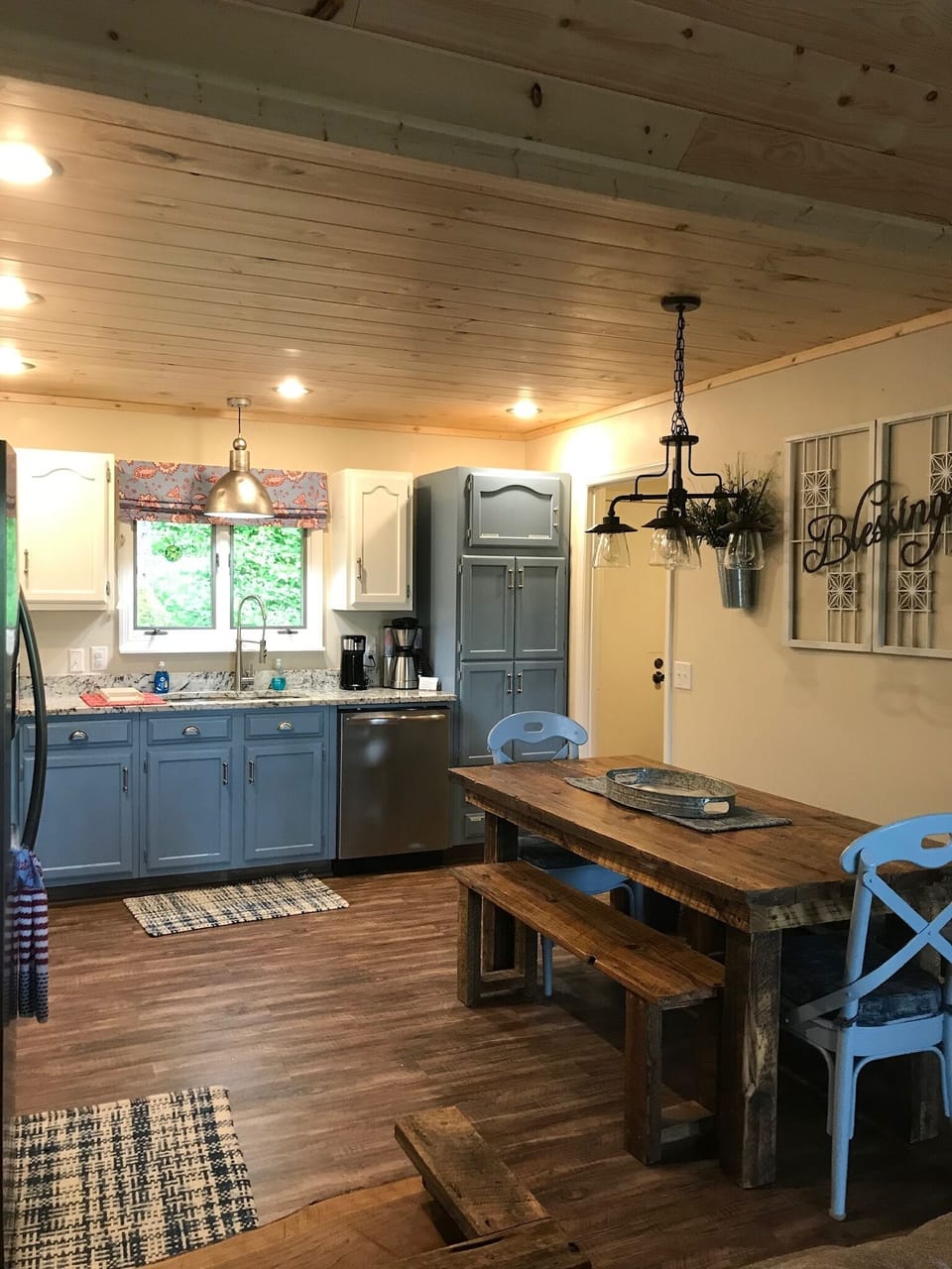 Updated kitchen with rustic country dining table and benches
