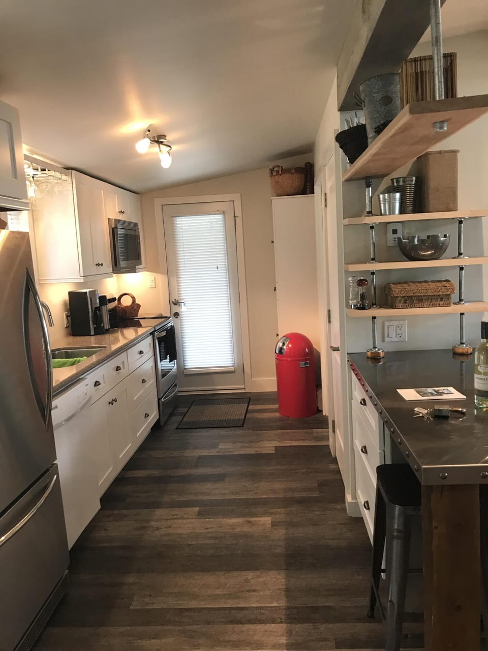 Quartz countertops.  convenient door to covered gas bar b q and recycling bins 