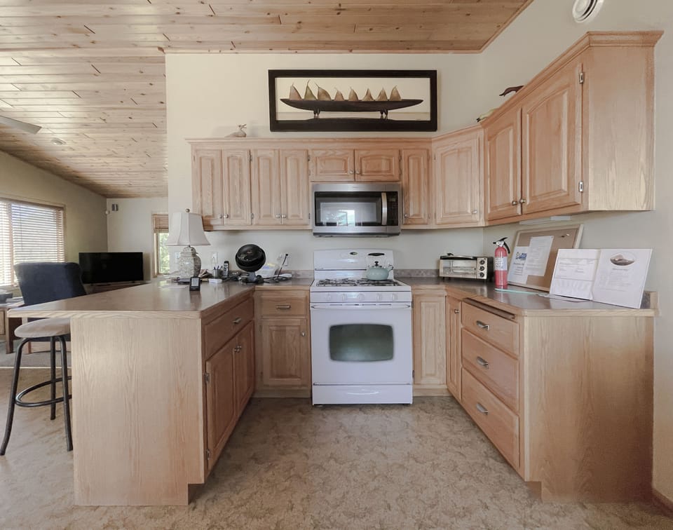 Kitchen, gas stove, microwave and counter space for cook projects.