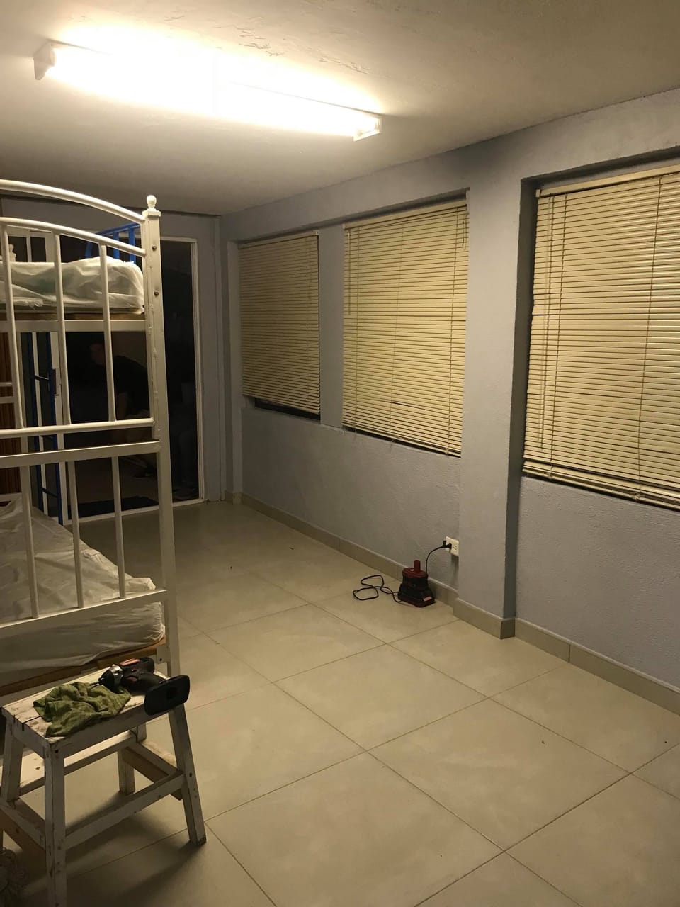 Room with twin bunk beds, has no door.