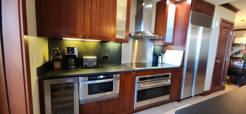 Sub Zero fridge, Wolf oven & stove top, wine cooler, slide out microwave