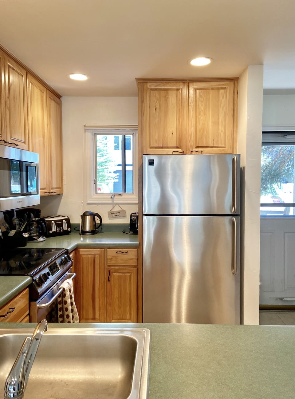 Kitchen area, front door to outside patio