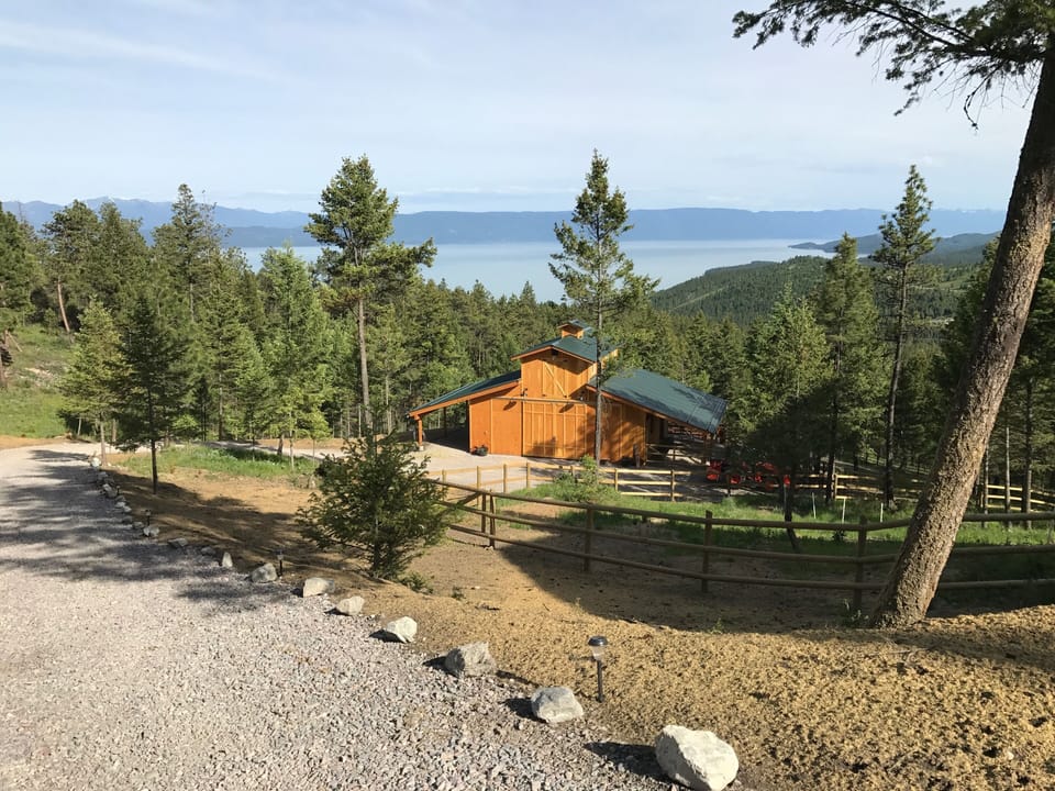 Driveway down to "Glamping" option barn loft, a recreated rustic Pioneer Cabin.