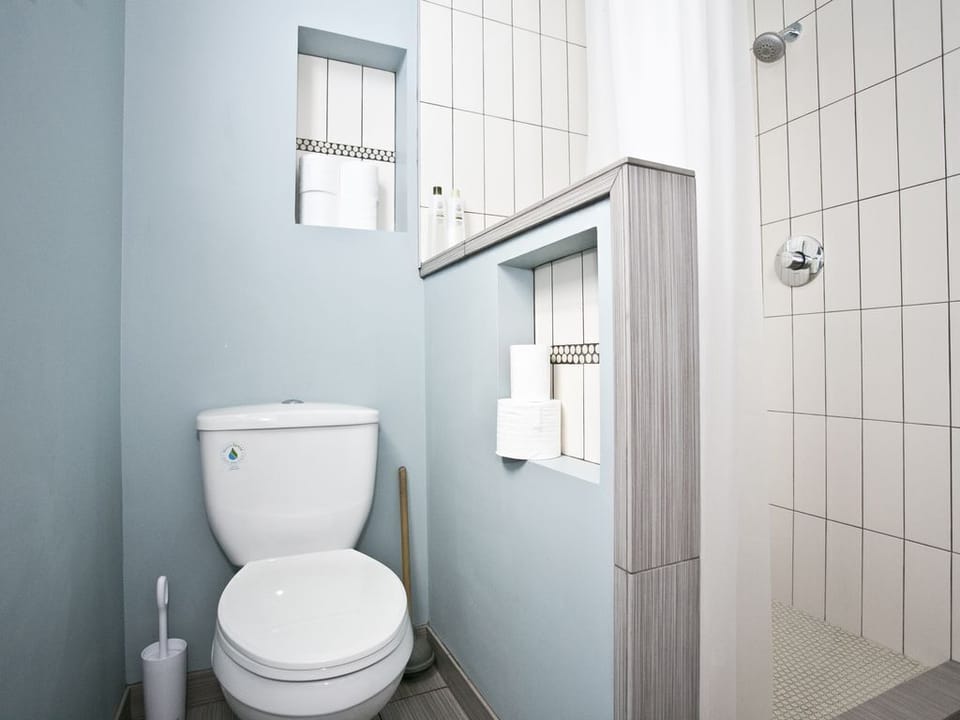 Full bathroom on the main floor with beautiful tiled shower.