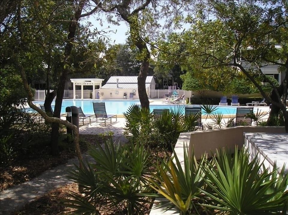 Out the back door, around the bend, you're at the pool.