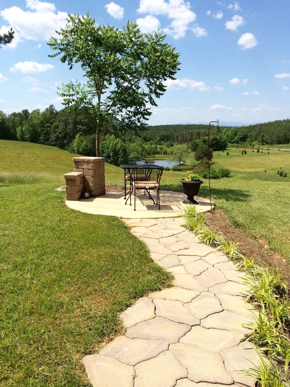 walkway to small patio overlooking pond
