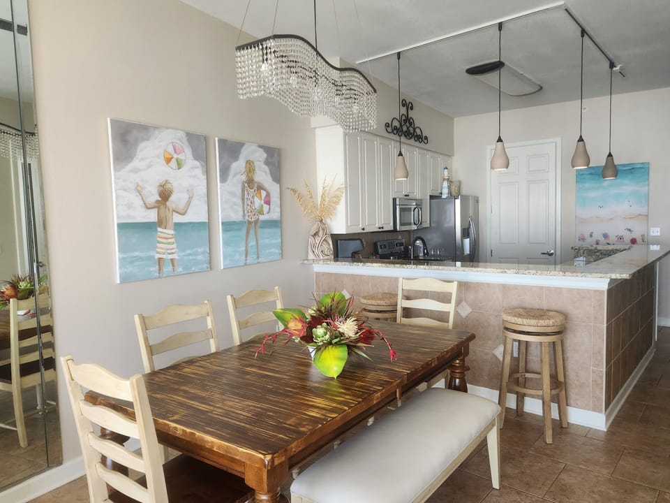 Dining area and kitchen.  Both have beach views. 