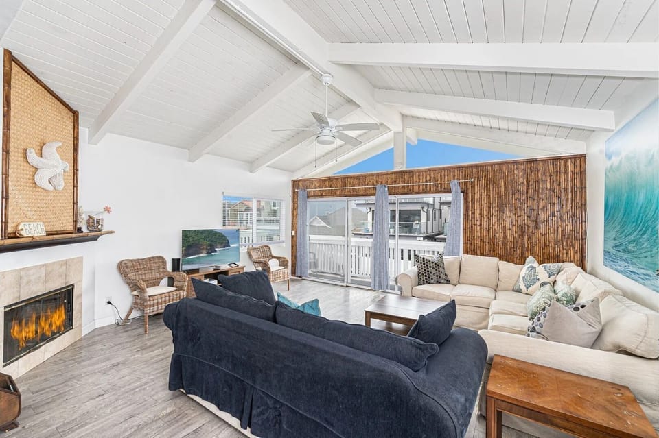 Spacious living areas open up to the front balcony of this upper 3 bd/2 ba ocean view unit.
                