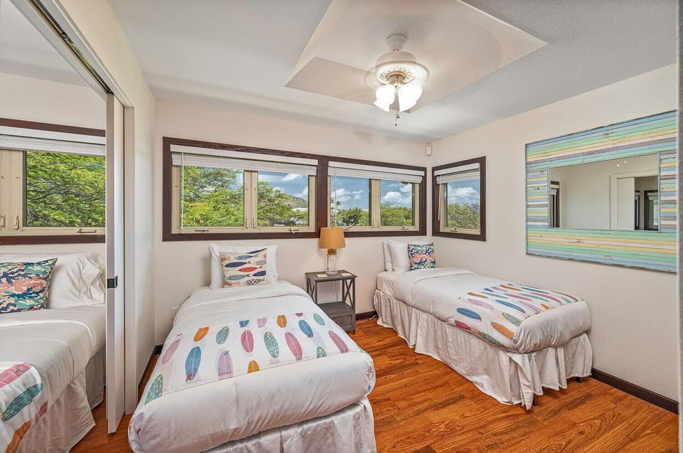 Guest Bedroom 5 with two twin beds, convertible to a king upon request, connected to Bedroom 4.